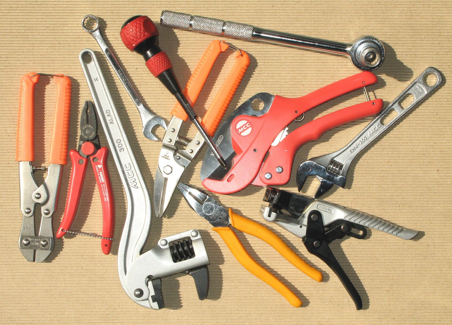 Well-used hand tools on a timber workbench